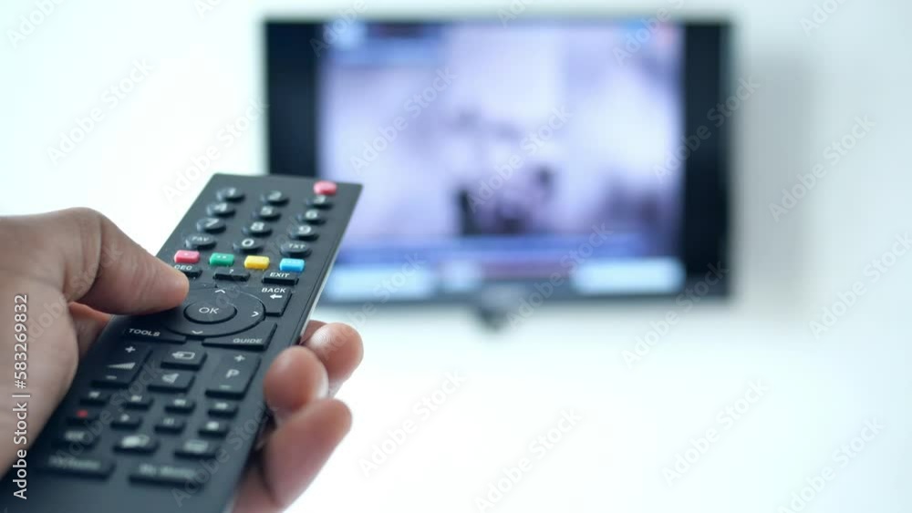 close up of man hand holding tv remote. close up of man hand holding tv remote.