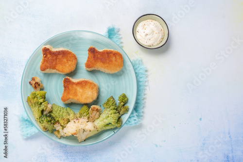 Kids food. Fish shaped nuggets with vegetable, ready to eat.