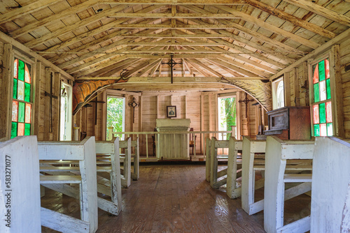 Fototapeta Inside an old southern church with crude painted glass