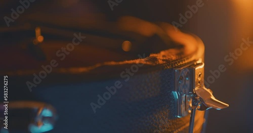 Close up of a musician unbuckling a mandolin case photo
