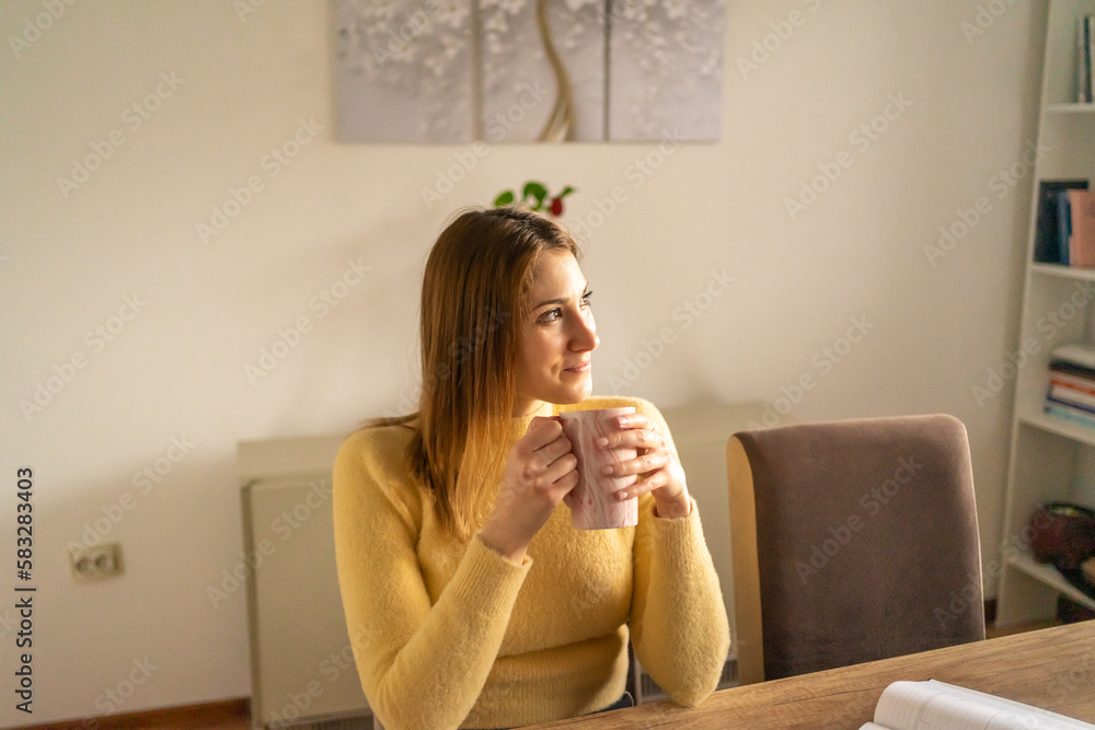 Close up photo of young woman drinking tea from home in the morning. Close up photo of young woman drinking tea from home in the morning.