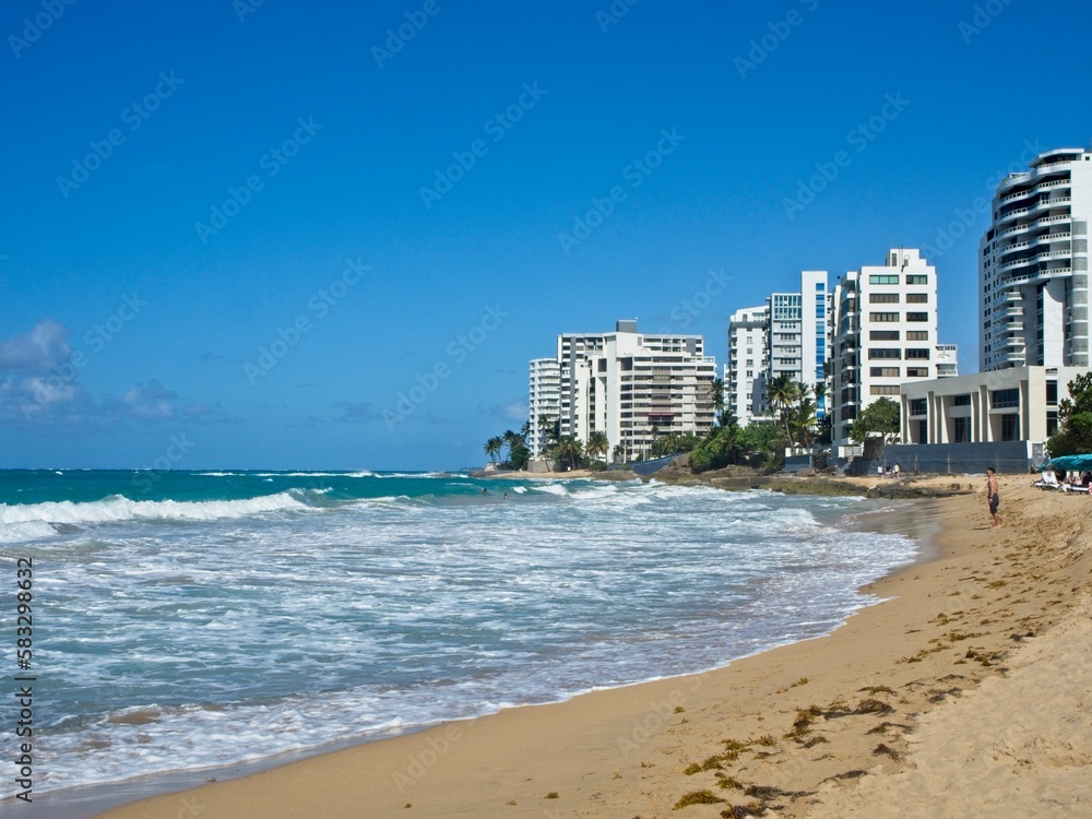 Beautiful (and strong) turquoise waves crash on the shores of Playa Condado (Condado Beach). These waves were so strong I got knocked down several times and lost two pairs of sunglasses Beautiful (and strong) turquoise waves crash on the shores of Playa Condado (Condado Beach). These waves were so strong I got knocked down several times and lost two pairs of sunglasses