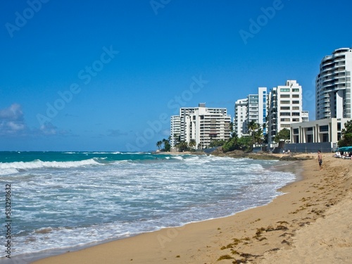 Beautiful (and strong) turquoise waves crash on the shores of Playa Condado (Condado Beach).  These waves were so strong I got knocked down several times and lost two pairs of sunglasses © Andrew