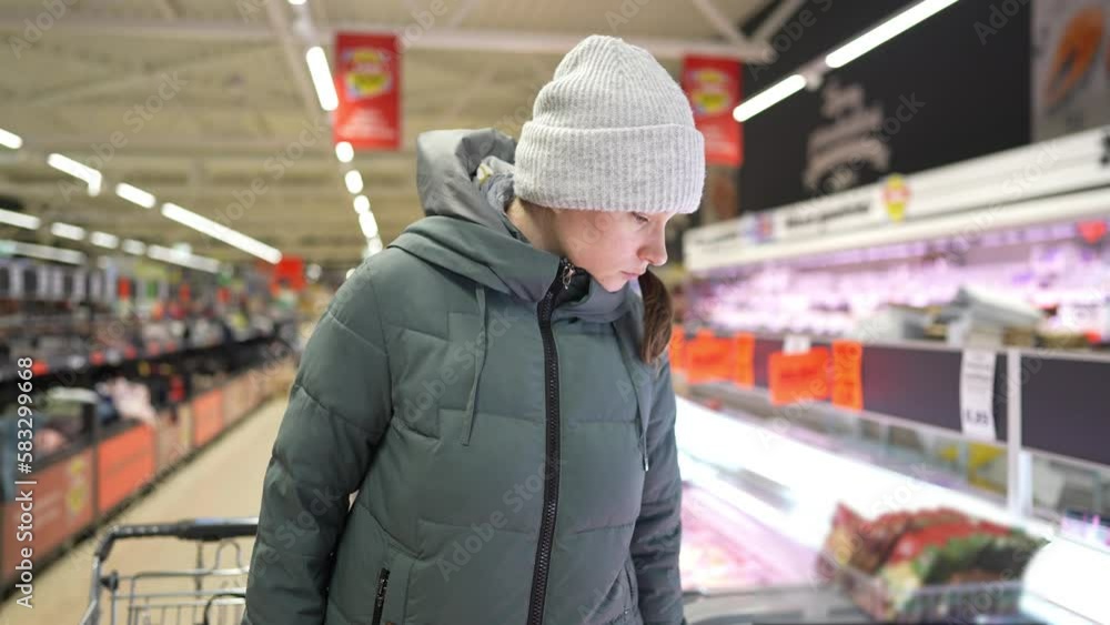 girl chooses groceries in a network grocery store, discounted goods girl chooses groceries in a network grocery store, discounted goods