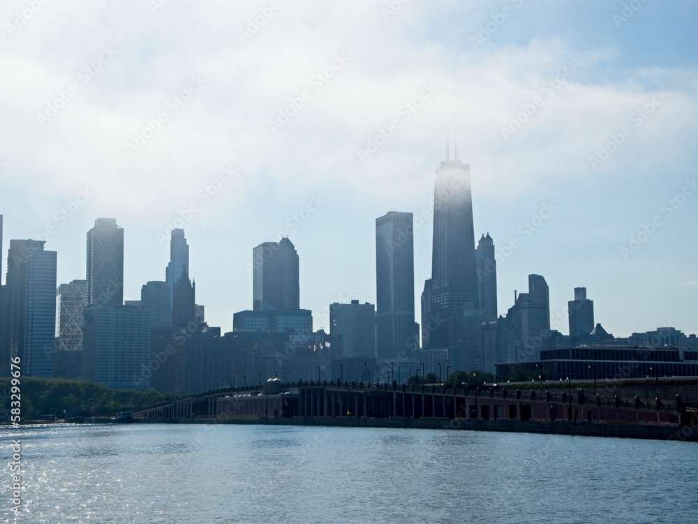 Clouds blow in off of Lake Michigan as Chicago's impressive skyline looms above the shoreline