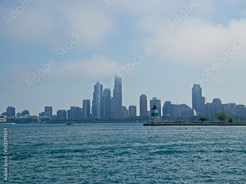 Clouds blow in off of Lake Michigan as Chicago's impressive skyline looms above the shoreline