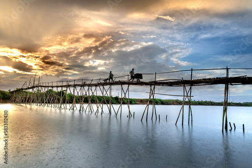 Farmers go to work on a bridge made of bamboo at Cam Dong village  Quang Nam province  Vietnam