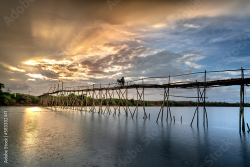 Farmers go to work on a bridge made of bamboo at Cam Dong village  Quang Nam province  Vietnam