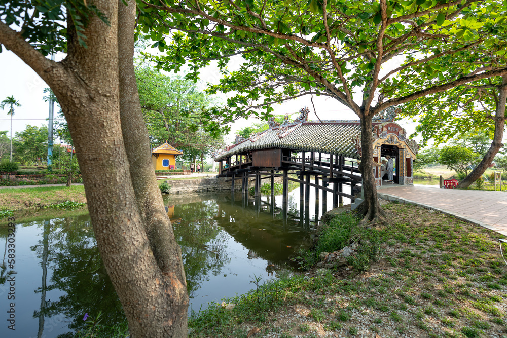 Thanh Toan Ancient Tiled Bridge is a wooden bridge with tiled roofs spanning a ditch in Thanh Thuy Chanh village, about 8 km southeast of Hue city, central Vietnam.
