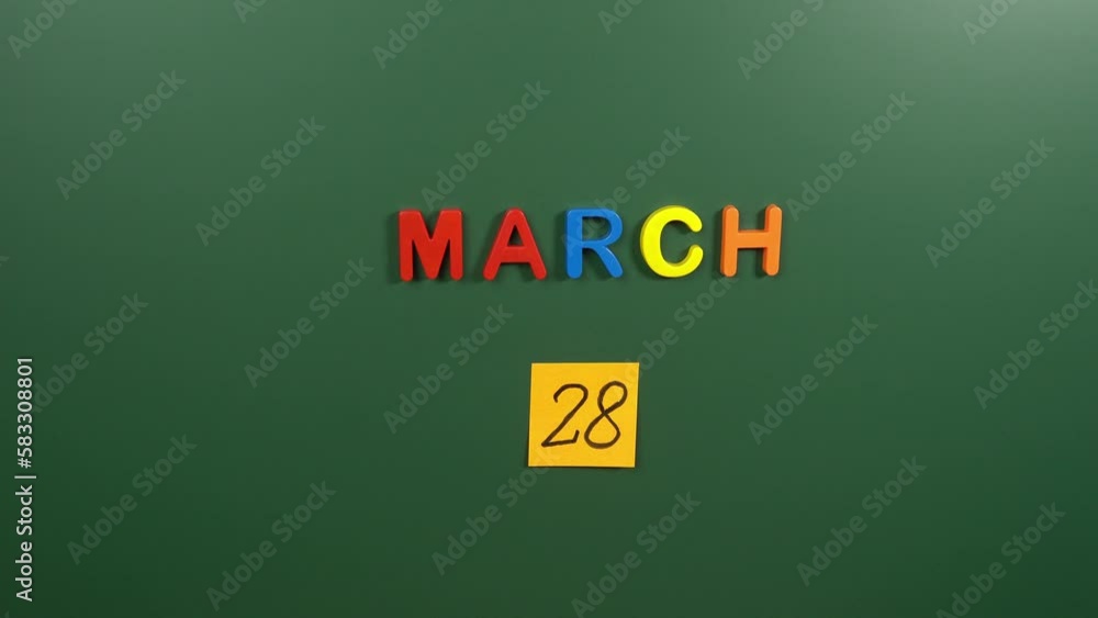 Hand sticking a sticker 28 March calendar day on school board. 28 date of March. Twenty eighth day of March. 28th date number. 28 day calendar. Twenty eight date. Respect Your Cat Hand sticking a sticker 28 March calendar day on school board. 28 date of March. Twenty eighth day of March. 28th date number. 28 day calendar. Twenty eight date. Respect Your Cat