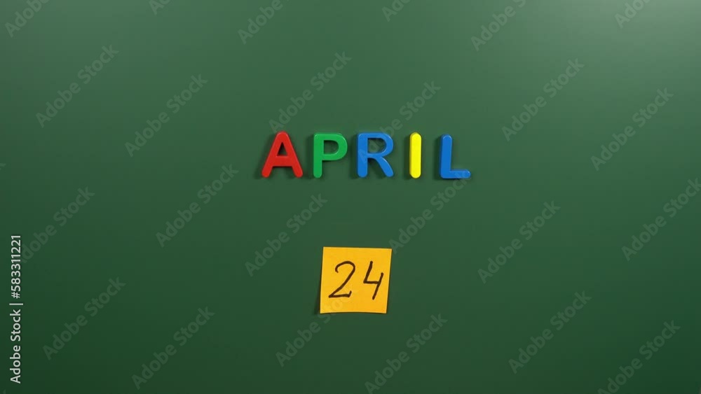 Hand sticking a sticker 24 April calendar day on school board. 24 date of April. Twenty fourth day of April. 24th date number. 24 day calendar. Twenty four date. World for Laboratory Animals Hand sticking a sticker 24 April calendar day on school board. 24 date of April. Twenty fourth day of April. 24th date number. 24 day calendar. Twenty four date. World for Laboratory Animals