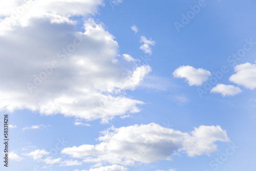 Blue sky with clouds in daylight symbolizing tranquility purity peaceful atmosphere sending a beautiful message from the heavens through nature and clouds during springtime with environmental beauty
