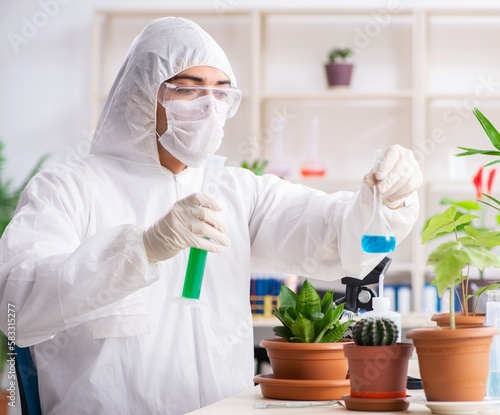 Biotechnology chemist working in lab