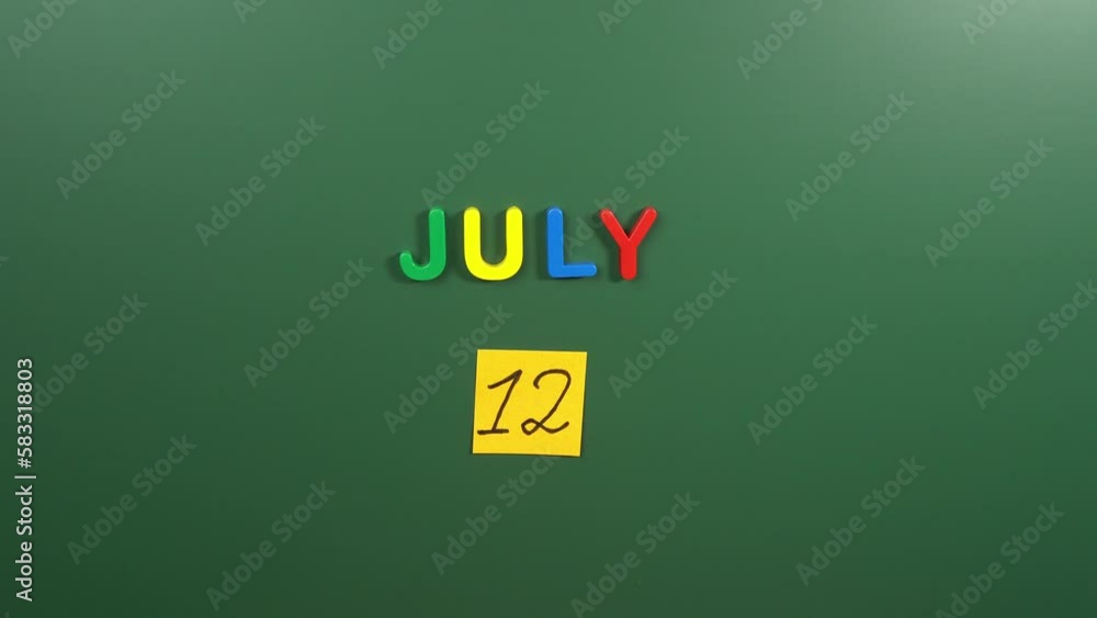 Hand sticking a sticker 12 July calendar day on school board. 12 date of July. Twelfth day of July. 12th date number. 12 day calendar. Twelve date. Malala, Paper Bag Hand sticking a sticker 12 July calendar day on school board. 12 date of July. Twelfth day of July. 12th date number. 12 day calendar. Twelve date. Malala, Paper Bag