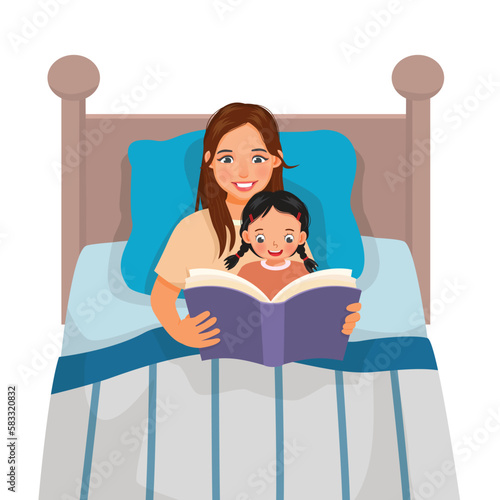 Young mother reading bedtime story book to her daughter in the bed
