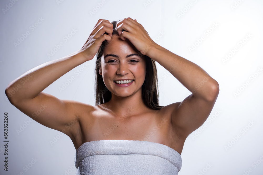 Fototapeta premium Glowing Beauty: Young Woman's Beauty Routine on White Background