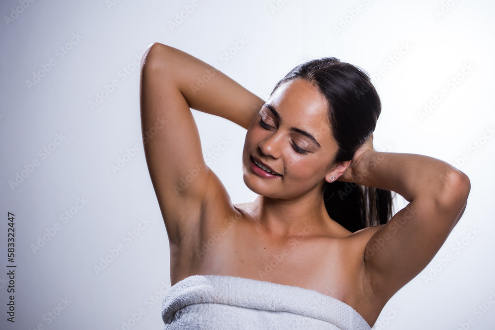 Fototapeta premium Glowing Beauty: Young Woman's Beauty Routine on White Background