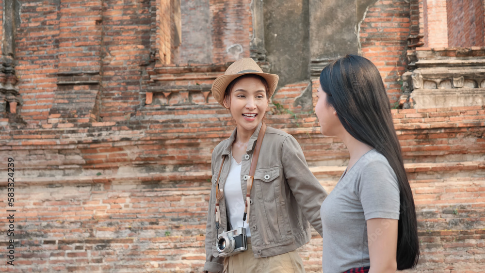 Two Asian women enjoyment in the old town. Phra Nakhon Si Ayutthaya, Thailand. Traveling on holidays