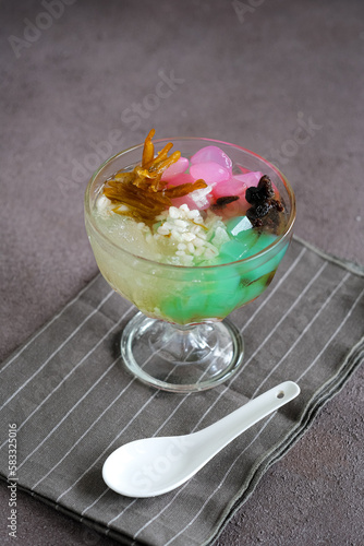 ice sekoteng is Indonesian sweet dessert with jelly, barly, palm seed, dried orange and dried grape photo