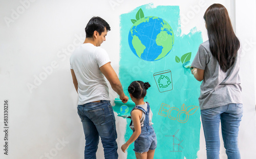 Portrait of asian family father and mother with little girl look at paint saving clean energy earth globe world environment green eco friendly.campaign save the earth and earth Day 22 April