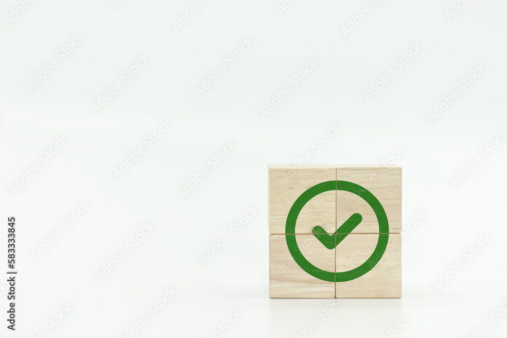 Wooden cube with green checkmark icon. Corporate regulatory and compliance. Goals achievement and business success. Task completion. Ethical corporate. Do the right thing. Quality and ISO symbol. Wooden cube with green checkmark icon. Corporate regulatory and compliance. Goals achievement and business success. Task completion. Ethical corporate. Do the right thing. Quality and ISO symbol.