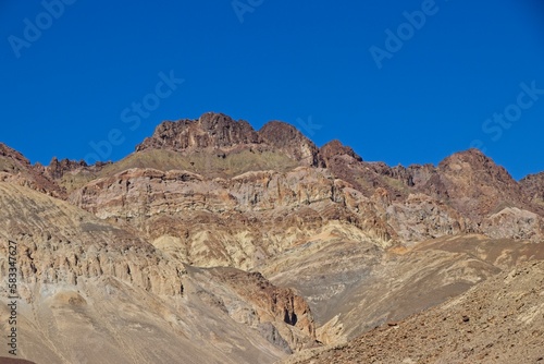 Driving along Artist's Drive, a one-way scenic loop in Death Valley, reveals rocks with a surprising number of colors. It is home to Artist's Pallette, which has a dusting of green and pink colors. © Andrew