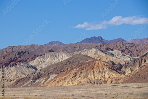 Driving along Artist's Drive, a one-way scenic loop in Death Valley, reveals rocks with a surprising number of colors. It is home to Artist's Pallette, which has a dusting of green and pink colors.