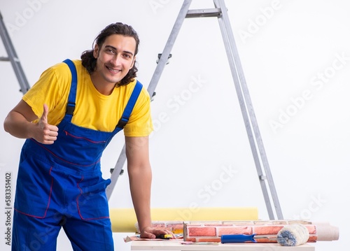 Young man contractor doing renovation at home