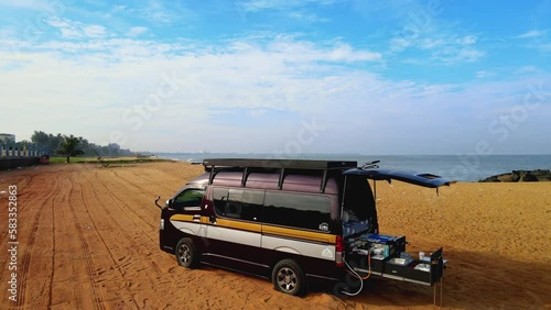 Campervan parked on the beach in Sri Lanka photo