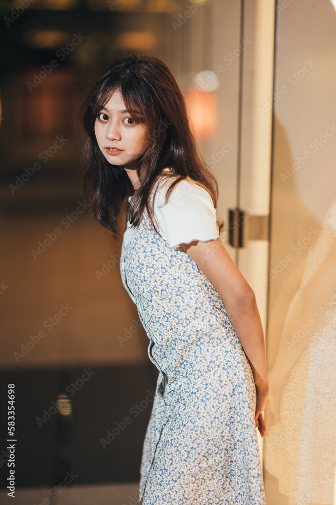 portrait of an asian girl in the city at night