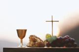 Holy Communion, which symbolizes the holy blood and flesh of Jesus Christ. The Last Supper. Bread, wine, the Bible, the Holy Grail, and the cross. The background of the Lent Passion Week. Easter conce