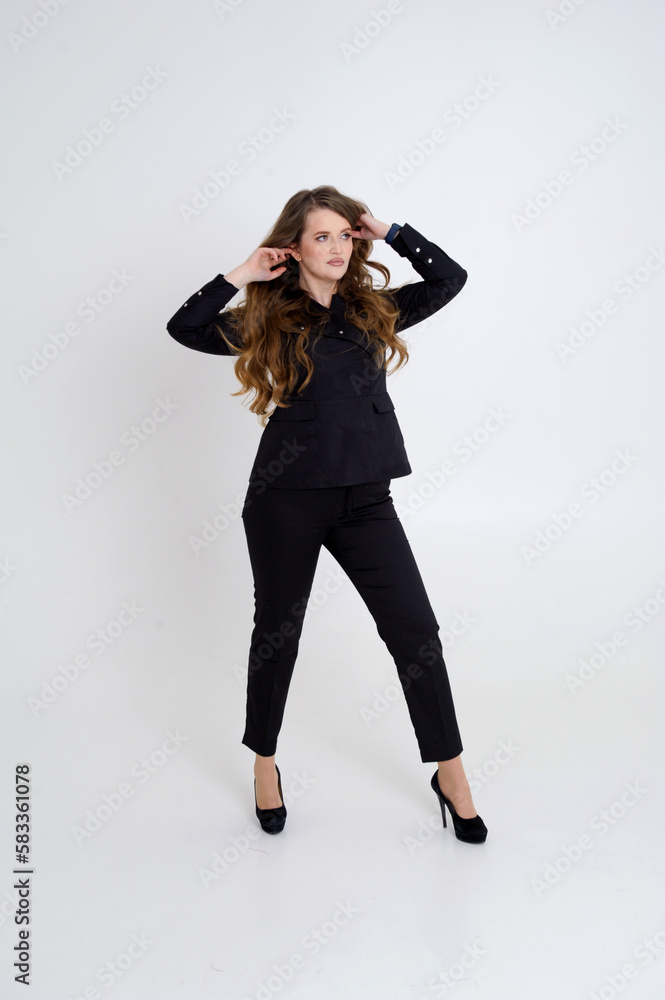 beautiful caucasian blonde woman in black clothes sitting and posing on chair on white. High quality photo beautiful caucasian blonde woman in black clothes sitting and posing on chair on white. High quality photo