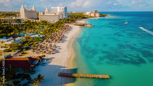 Картината върху платно Palm Beach Aruba Caribbean, white long sandy beach with palm trees at Aruba Anti