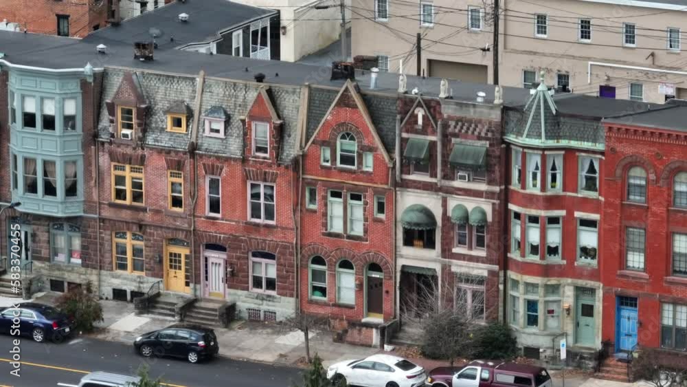 Long aerial zoom of housing in city. Row houses in downtown urban