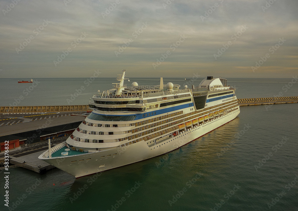 Classic white fun ship cruisehip cruise ship liner Blu in port of Malaga, Spain during summer Mediterranean cruising Classic white fun ship cruisehip cruise ship liner Blu in port of Malaga, Spain during summer Mediterranean cruising