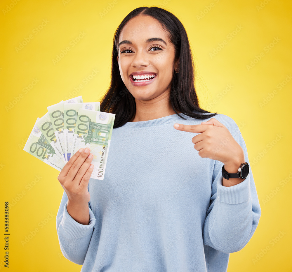 Woman, happy and cash in studio portrait for bonus, winning or profit by yellow background. Young student girl, winner and money fan with pointing at bills for celebration of success on stock market Woman, happy and cash in studio portrait for bonus, winning or profit by yellow background. Young student girl, winner and money fan with pointing at bills for celebration of success on stock market