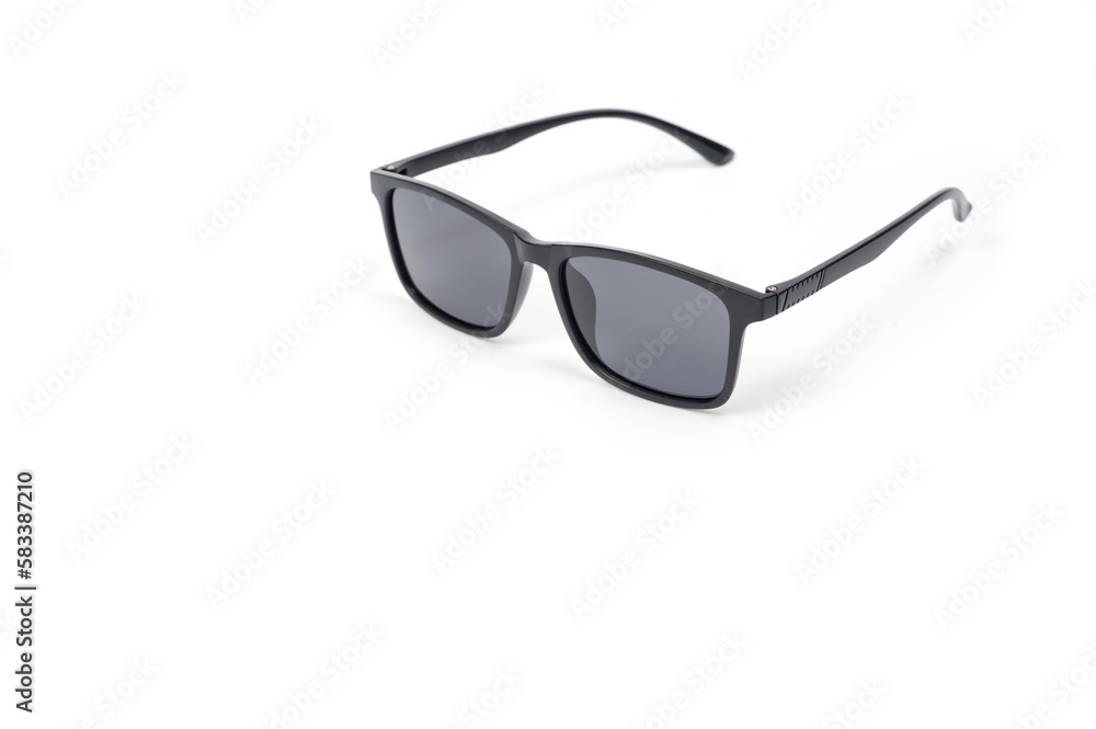 Black unisex sunglasses with polarized lenses, photographed against a white background. Black unisex sunglasses with polarized lenses, photographed against a white background.