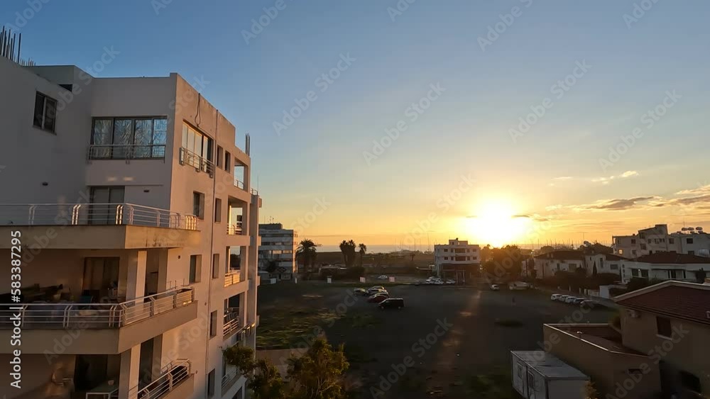 the sunrise over the Mediterranean Sea, from a hotel window in Larnaca, Cyprus the sunrise over the Mediterranean Sea, from a hotel window in Larnaca, Cyprus