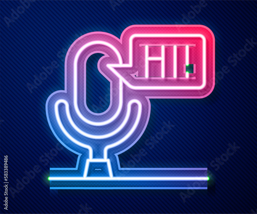 Glowing neon line Microphone voice device icon isolated on blue background. Microphone interpreter and alphabet letters. Vector