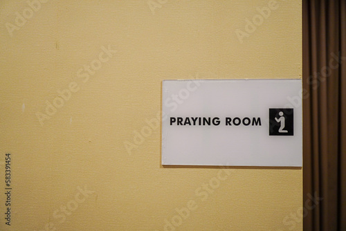 Close-up shot of praying room sign with copy space
