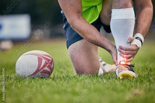 Photos Rugby, pain and man with foot injury on sports field for practice match, training and game on grass