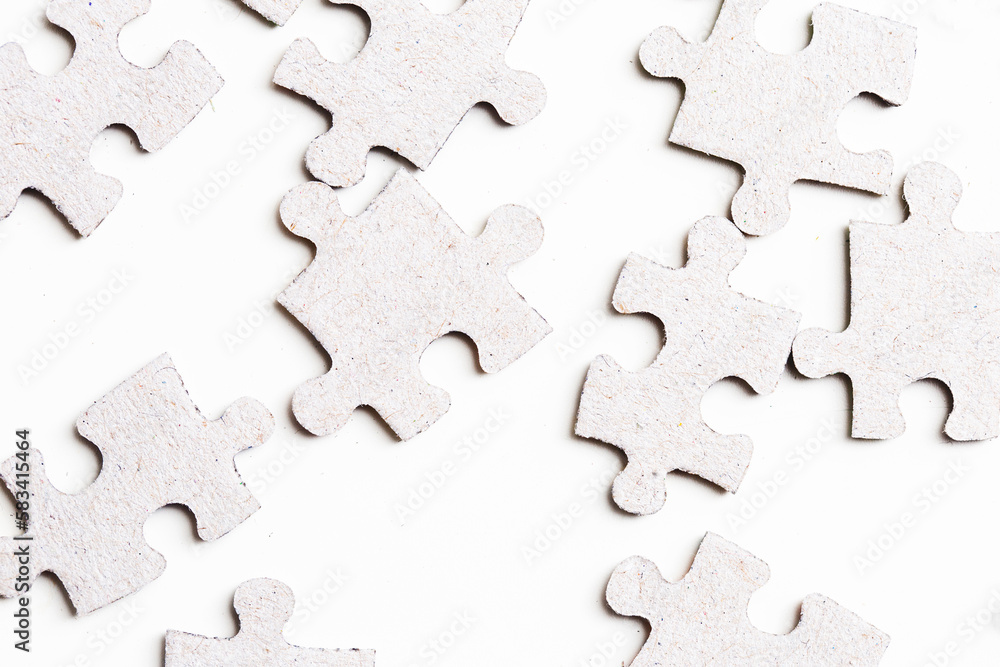 Pile of puzzle background. Puzzle pieces in mess texture. Symbol of chaos in life. Putting pieces together. Many parts stacked. Isolated on white. Pile of puzzle background. Puzzle pieces in mess texture. Symbol of chaos in life. Putting pieces together. Many parts stacked. Isolated on white.