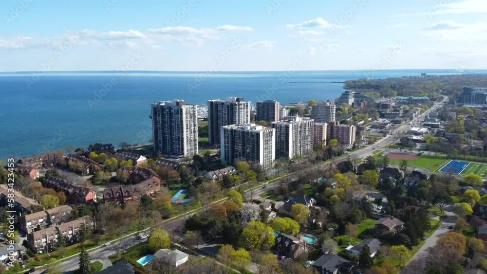 Drone orbiting around apartment buildings on the coastline of Lake Ontario in Oakville. Drone orbiting around apartment buildings on the coastline of Lake Ontario in Oakville.