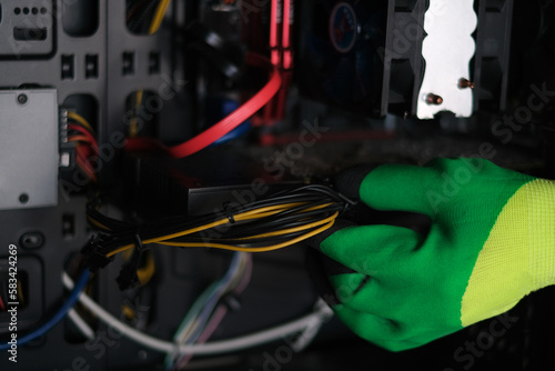 workshop repairman repairing computer system unit close-up