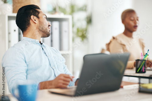 Office, talking and business man at desk on break in conversation, speaking and chatting to coworker. Creative startup, company and male worker with computer working on project, report and research