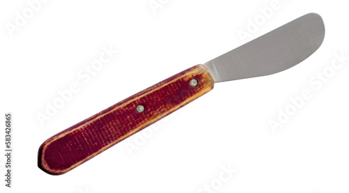 Old butter spreader knife with brown wooden handle isolated on white background photo