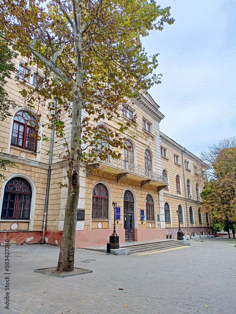 A panorama of a higher educational institution located in an ancient Odessa building against the background of a cloudy autumn sky.