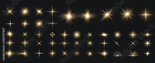 Golden particles of light. Golden light. Light flare.Stars isolated on transparent background.