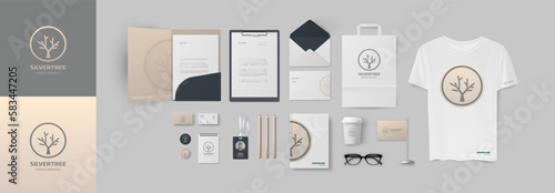 Design pack for modern company with minimal logo and corporate branding in grey and light brown colors. Set of ready elements include folder and A4 form, business card and paper bag, envelope and cup