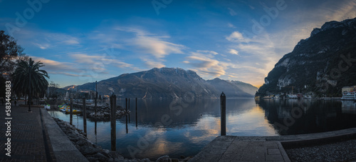 Pre-sunset evening view on lake Garda in Riva Del Garda city, Italy. January 2023.